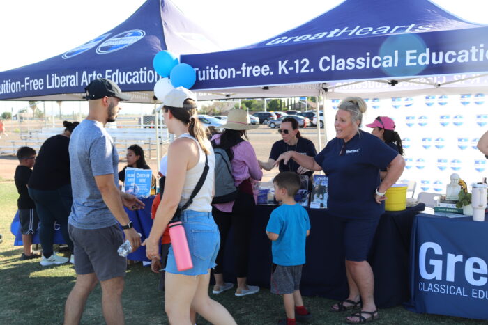 parents visiting an information booth