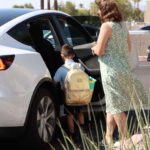 Teacher working the school pickup line