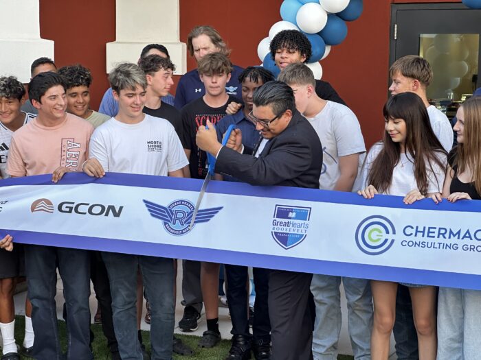 HM Cruz cutting ribbon at ceremony