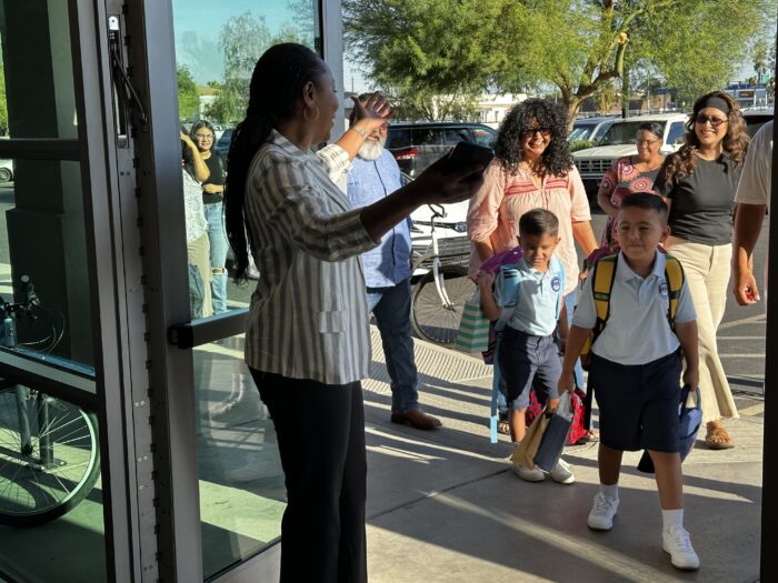 Toyin Atolagbe greeting student Thumbnail
