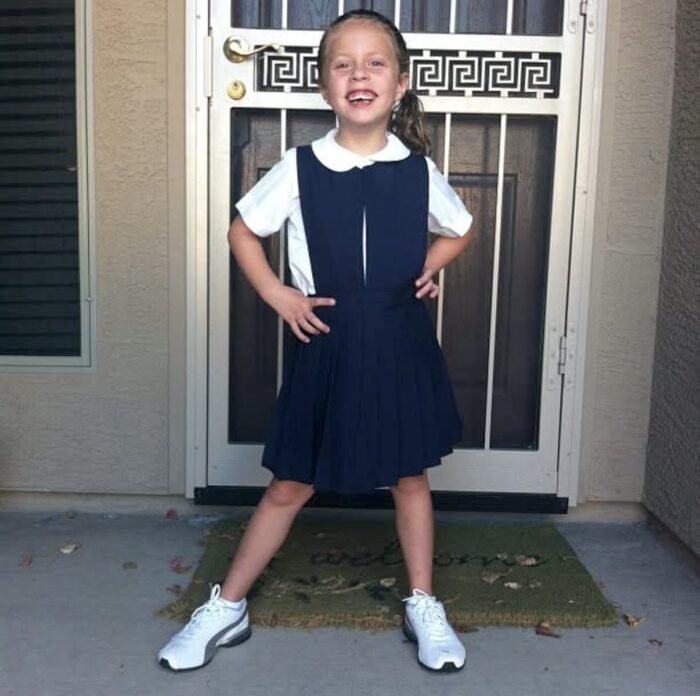 Kindergartener posing on porch