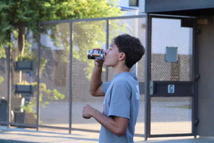 Runner drinking root beer at Root Beer Mile