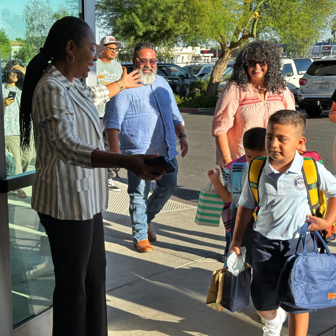 Toyin Atolagbe greeting student
