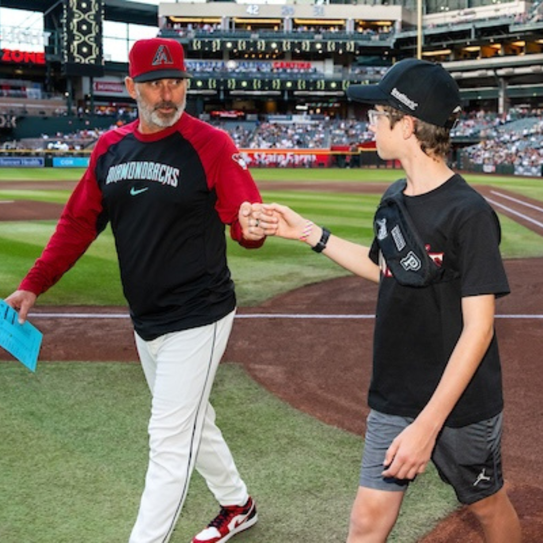 Student with team manager on Chase Field
