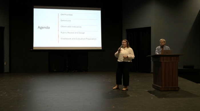 Two presenters with slides
