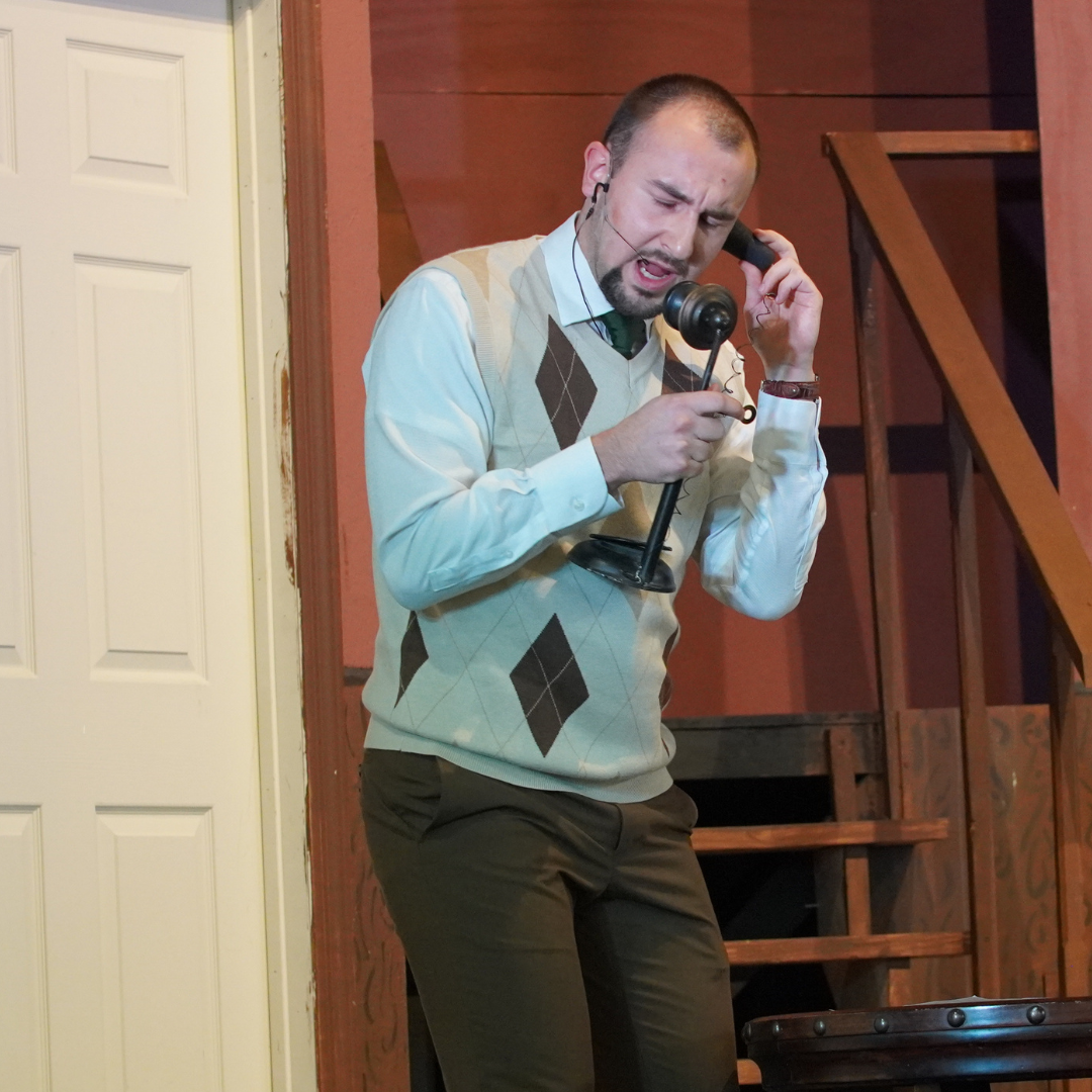 Teacher performing in Faculty Play