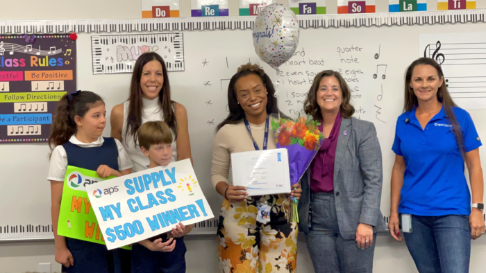 Teacher receiving award in her classroom