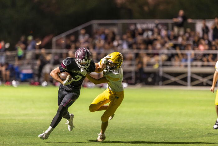 Trivium Prep football player on the field