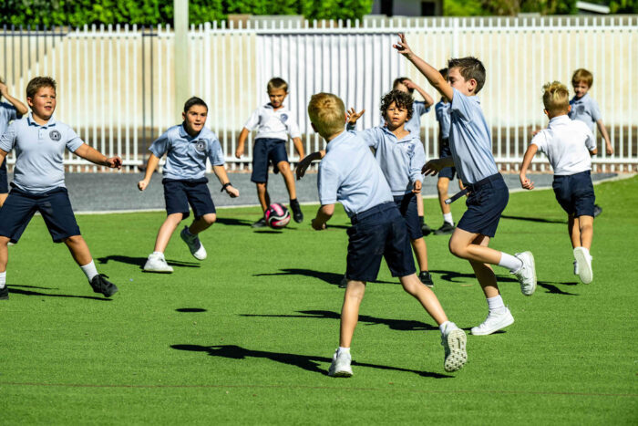 Archway Veritas Students running in field