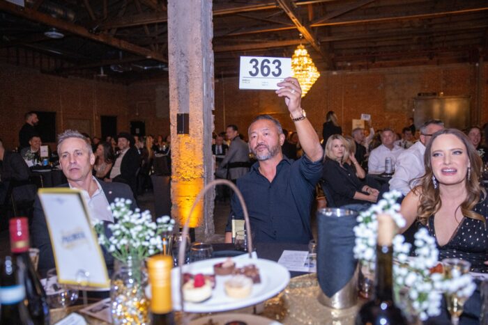 Attendees bidding at Gala