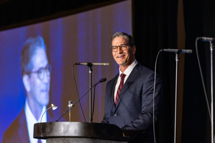 Dan Scoggin speaking at Symposium