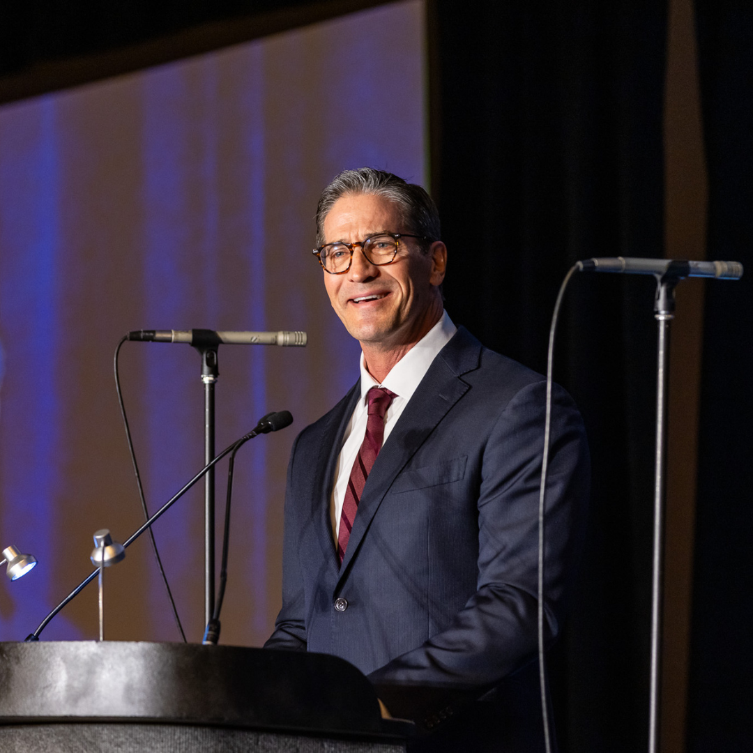 Dan Scoggin speaking at Symposium