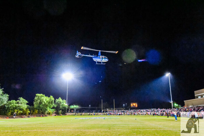 Helicopter flying over a field