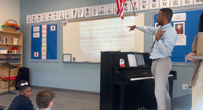 Mr Gatlin in front of classroom