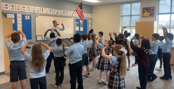 Mr Gatlin instructing students