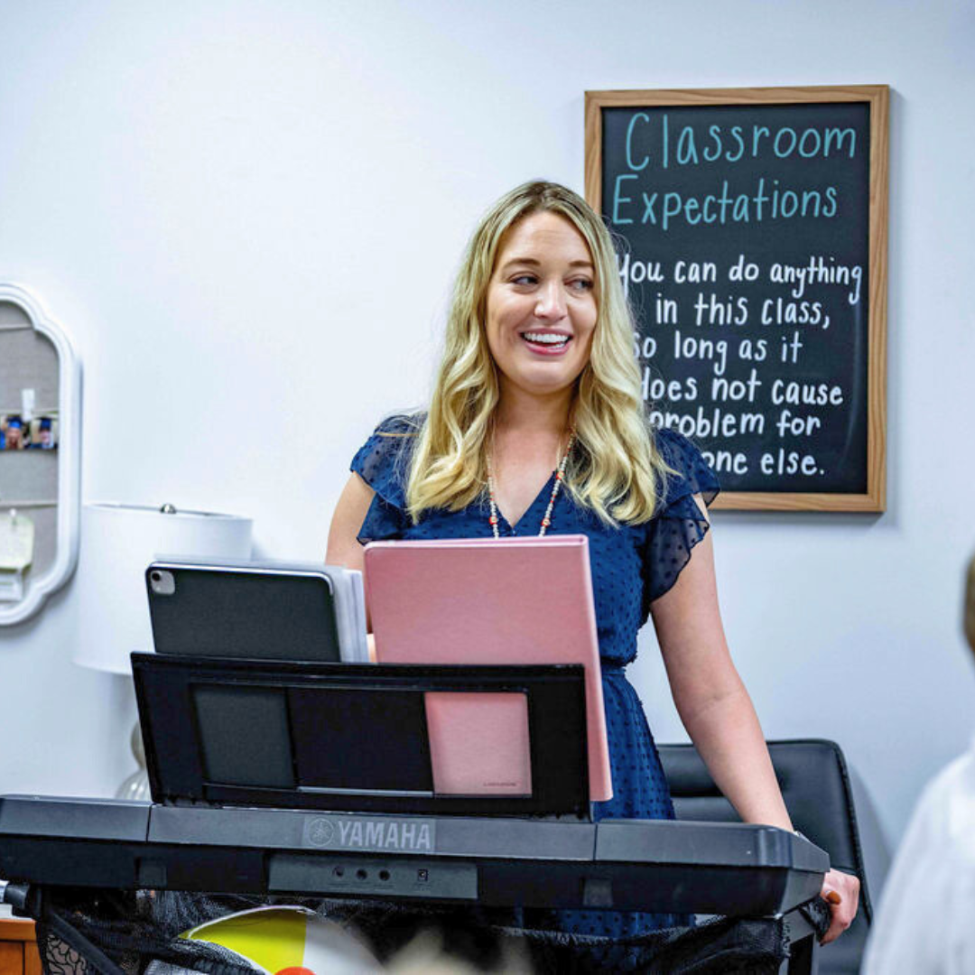 Music teacher at a keyboard