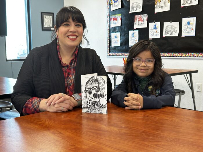 Girl and Headmaster with artwork