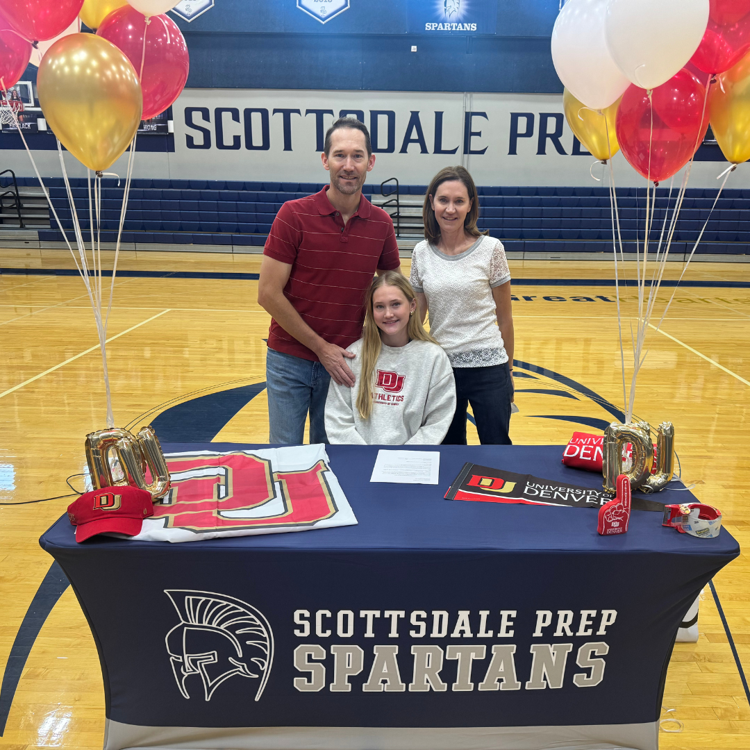 Scottsdale Prep student posing at table with parents
