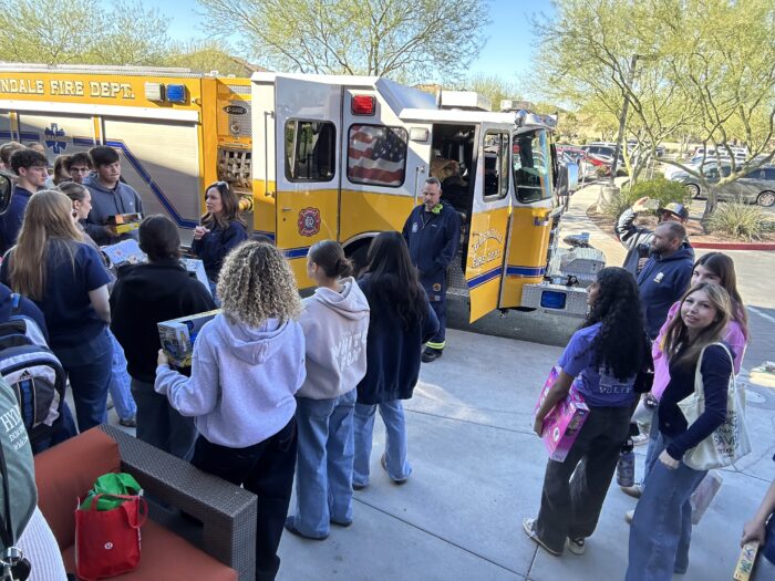 Seniors in front of a fire engine