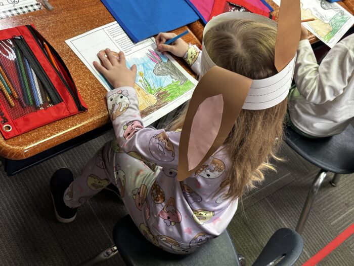 Student doing artwork at their desk