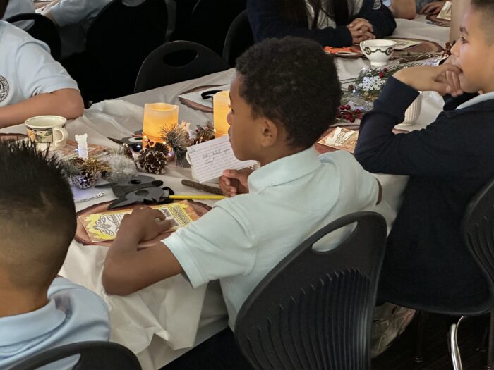 Student sitting at a tea party