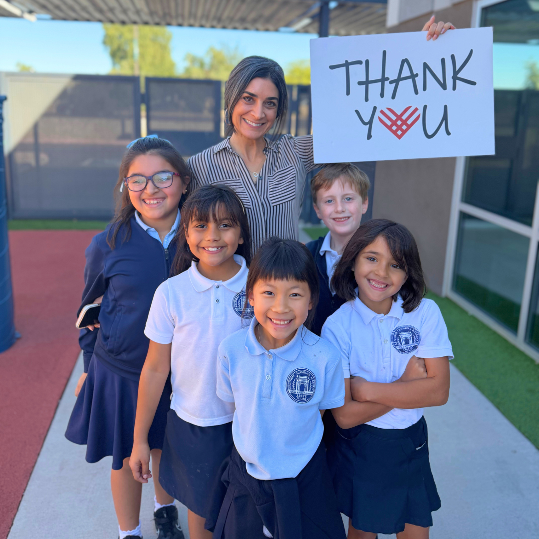 Students and faculty holding Thank You sign