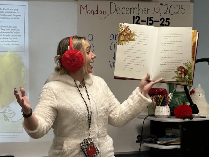 Teacher reading a story to a classroom