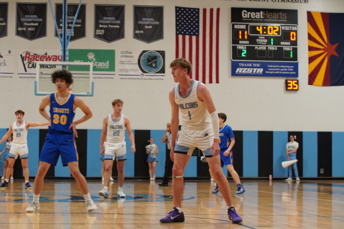 Basketball players on the court at Veritas Prep Hoopcoming