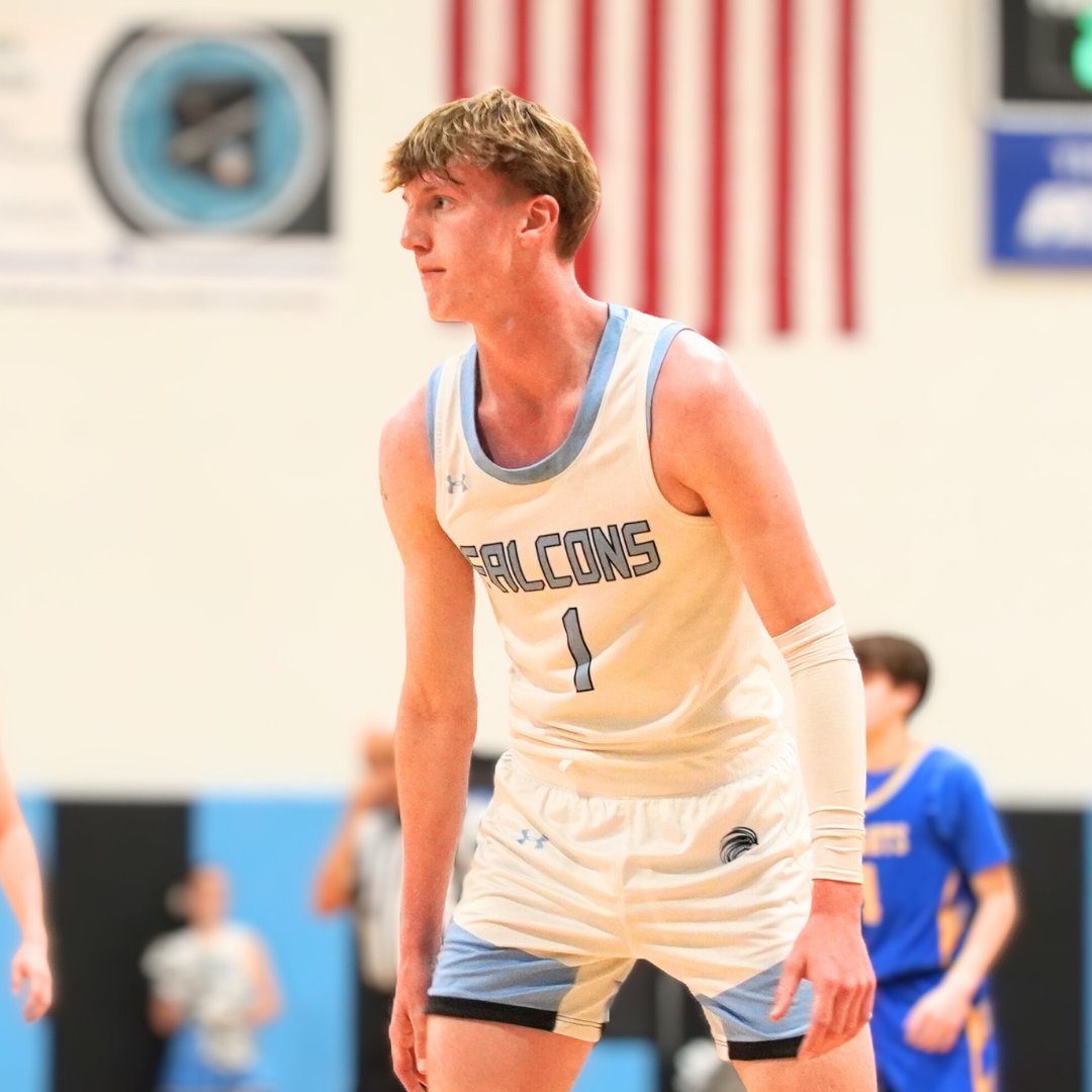 Basketball players on the court at Veritas Prep Hoopcoming