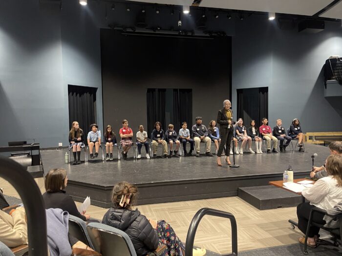 Students on stage before Spelling Bee