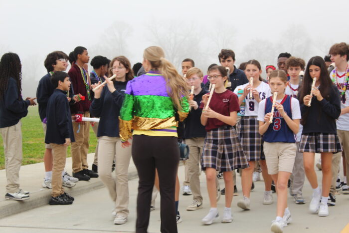Students playing recorders in parade