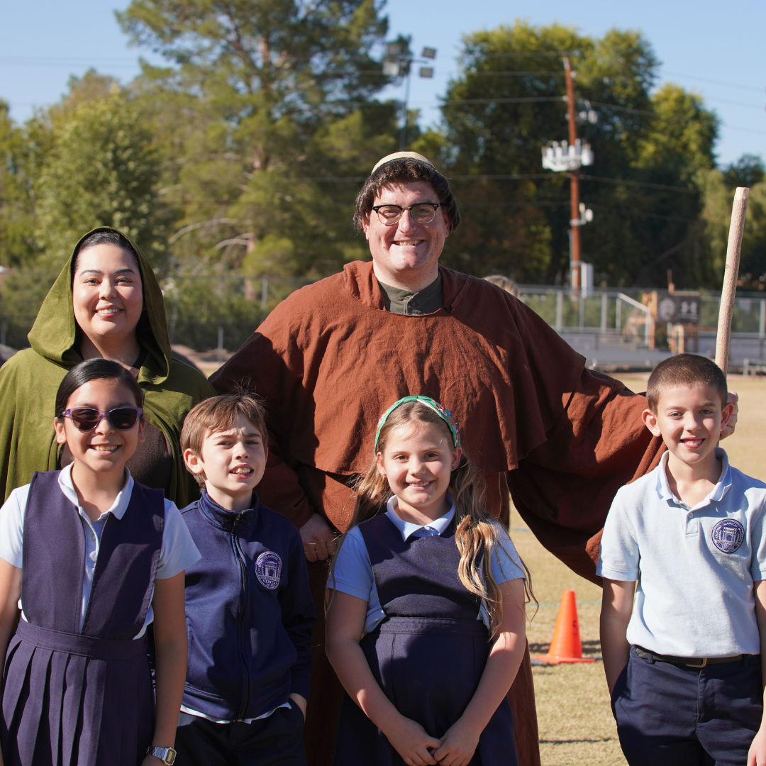 Two teachers in costume with students