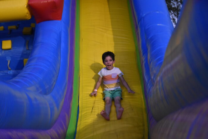 Boy going down slide