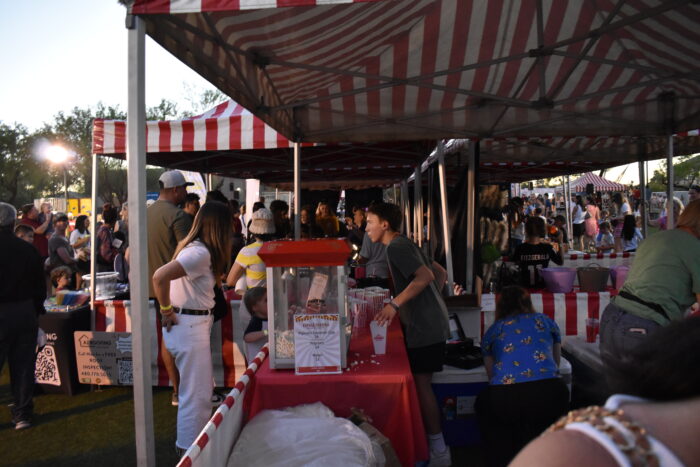 Student serving popcorn