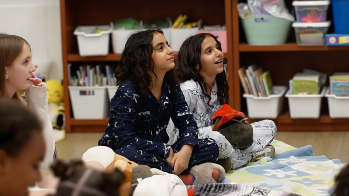 Students enjoying bedtime stories