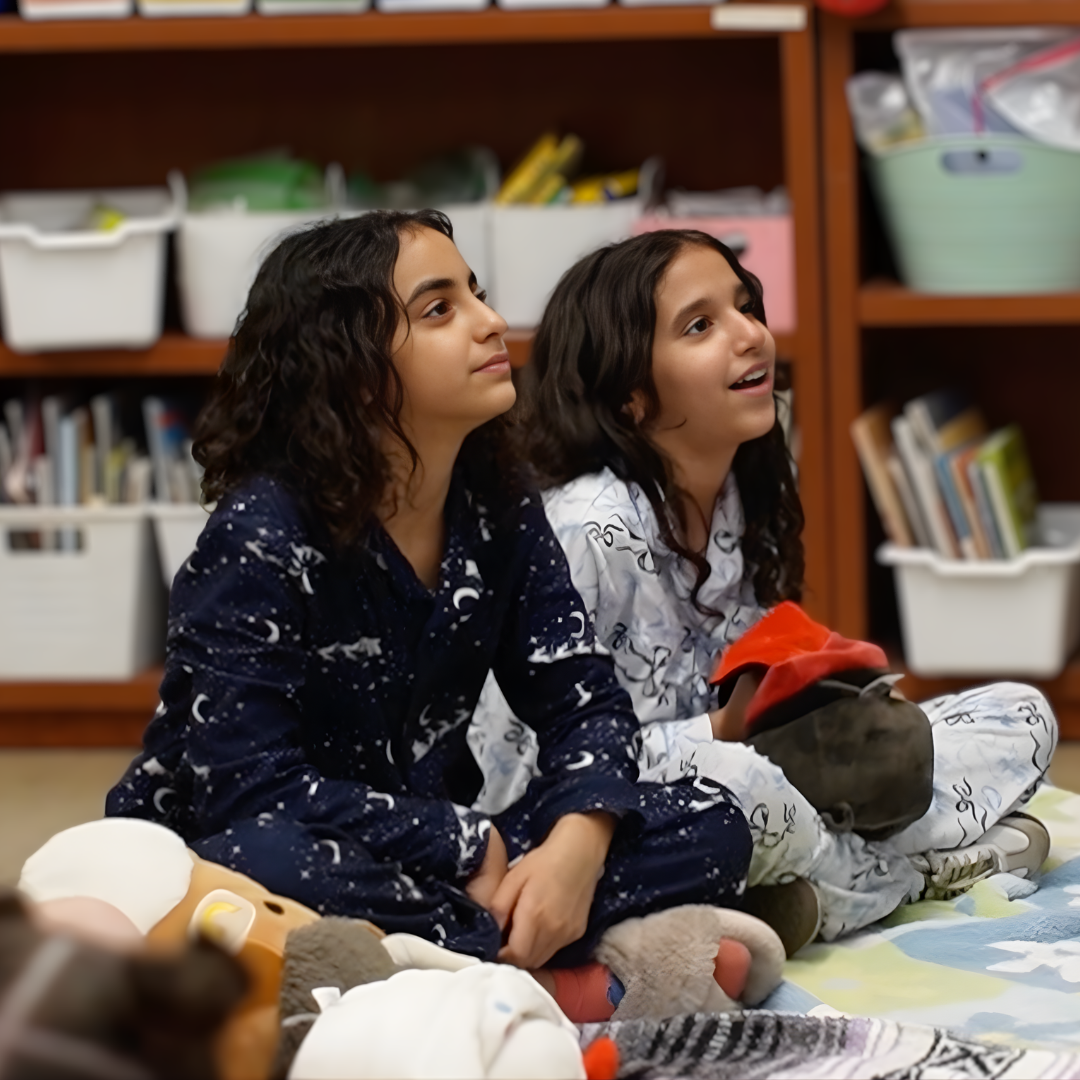 Students enjoying bedtime stories Thumbnail