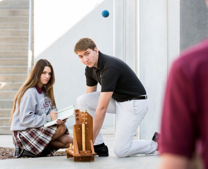 Two students working on physics project