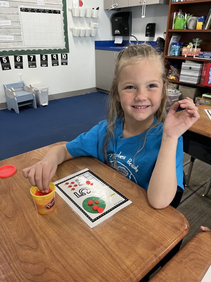 Kinder Readiness girl at a desk