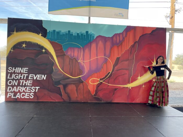 Student with her mural