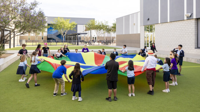 Students in the yard with a parachute