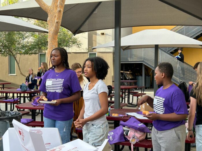 Three students at the Purple Star Breakfast