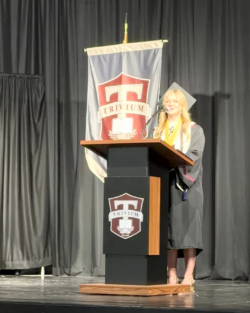 Bella Faser speaking at graduation ceremony