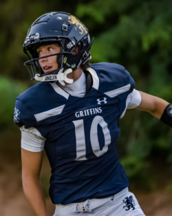 Dylan L. in football uniform