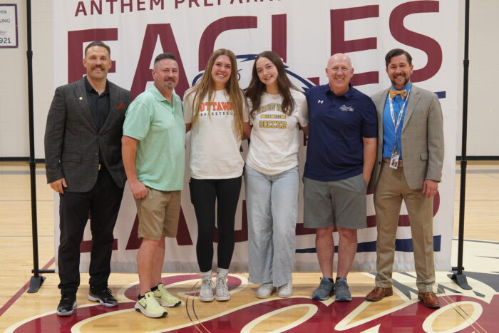 Madison and Lucy with coaches and staff