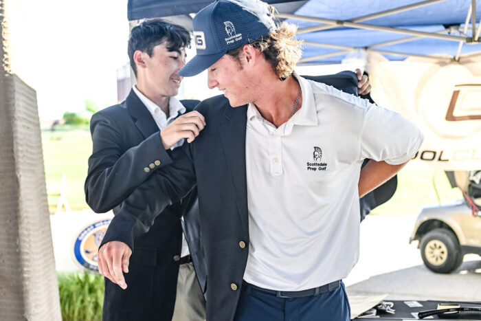 Champion recieving his jacket