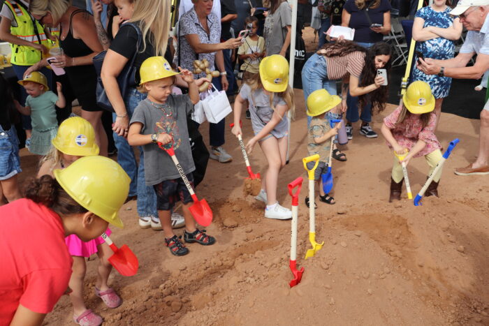 Children with hardhats and shovels