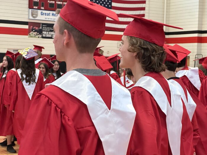 Chandler Prep graduates in a gym