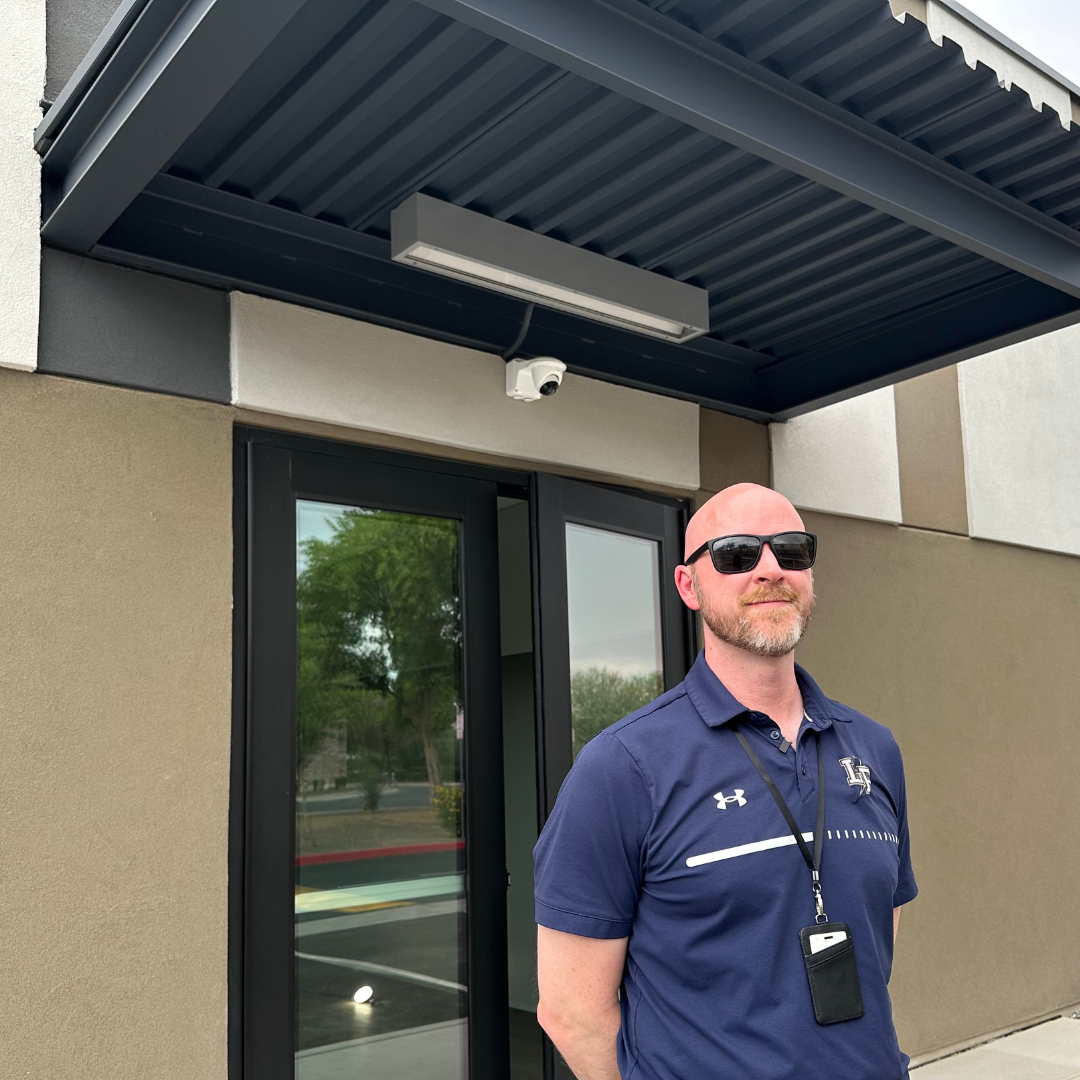 Headmaster outside of new building