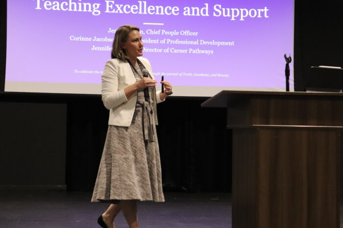 Jerilyn speaking on stage