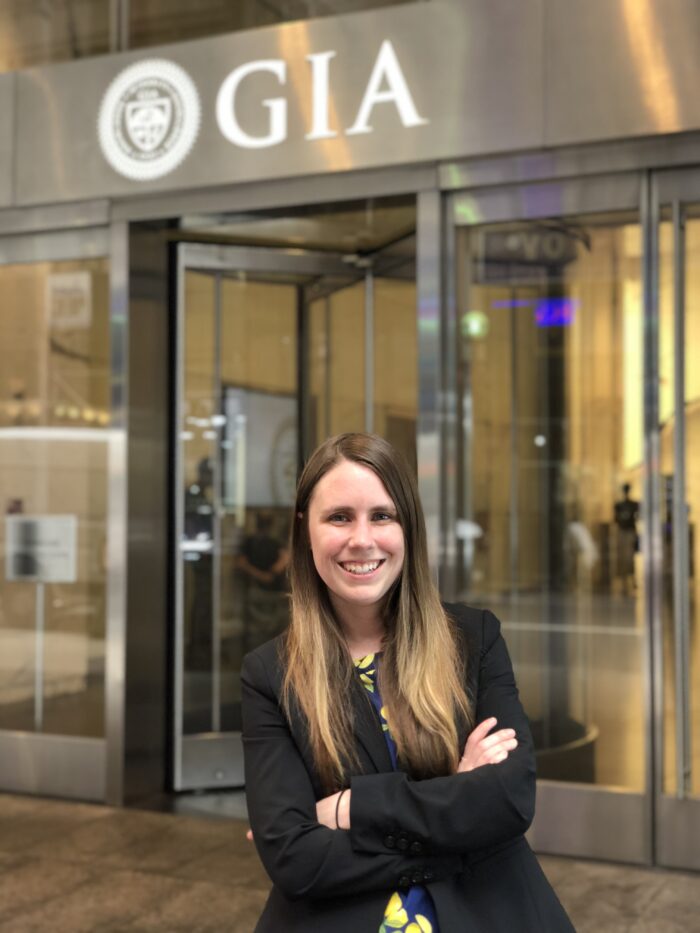 Michelle Paull in front of GIA signage